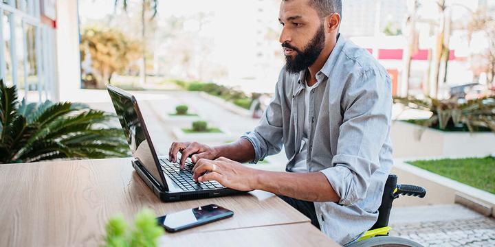 Social-Man-in-wheelchair-working-on-computer