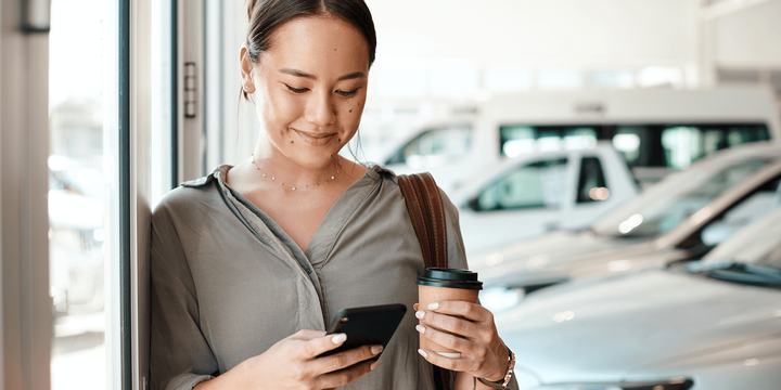 Woman at car dealership