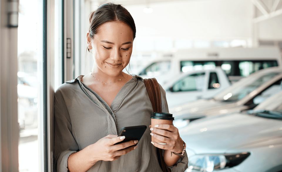 Woman at car dealership