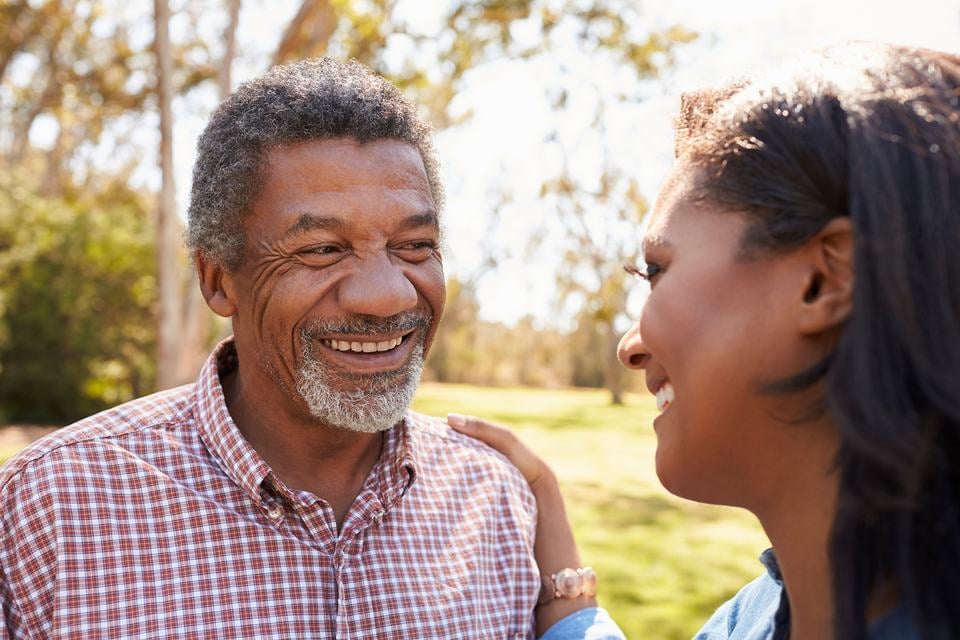 black-father-and-daughter-sharing-a-moment-smiling.jpg