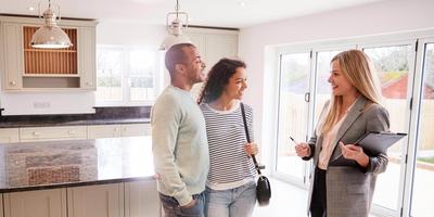 couple-talking-to-realtor-e1582580402746.jpg