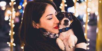 hero-women-holding-dog-outside-holidays.jpg