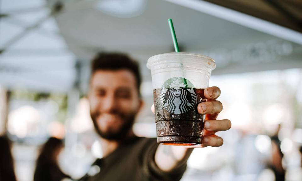 man-holding-starbucks-coffee-cup.jpg