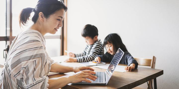 mother-working-laptop-with-children-at-table.jpg
