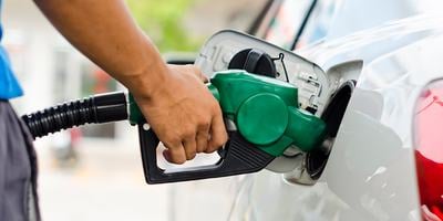 Pumping gas into a vehicle at the gas station
