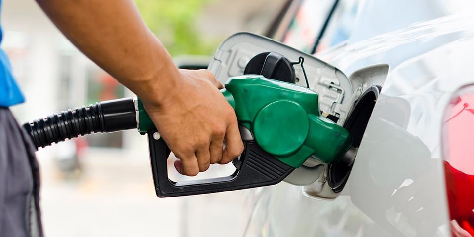 Pumping gas into a vehicle at the gas station