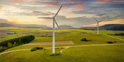 two-wind-turbines-in-open-field.jpg