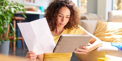 Woman reviewing home closing documents