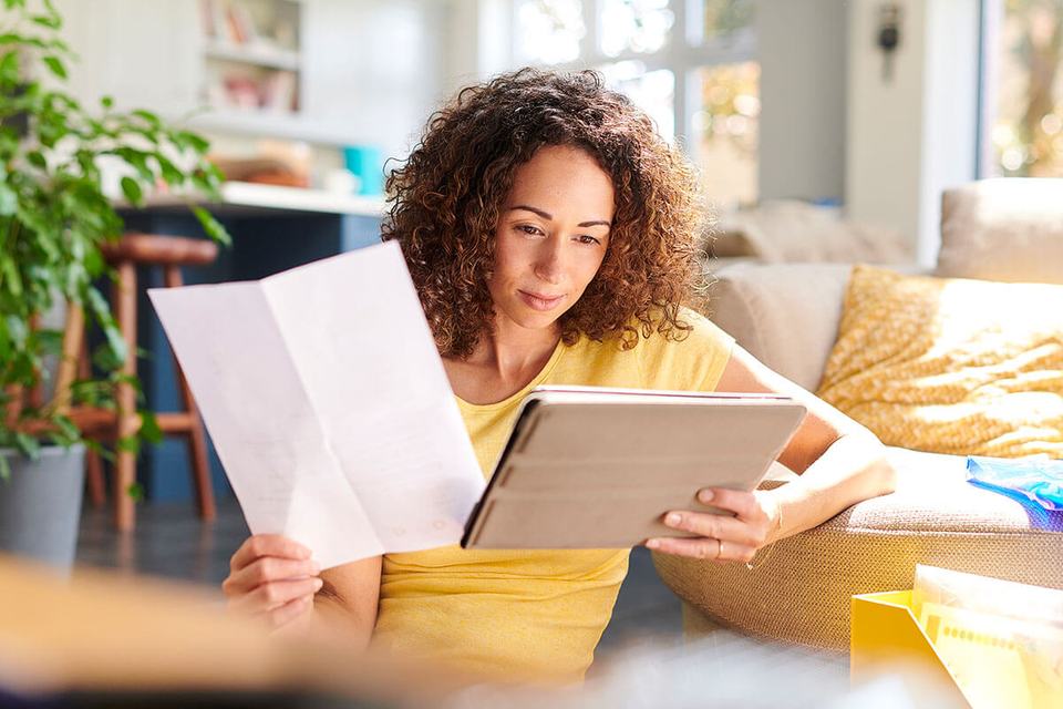Woman reviewing home closing documents