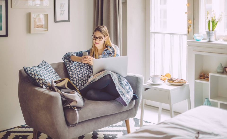 woman-using-technology-in-living-room.jpg