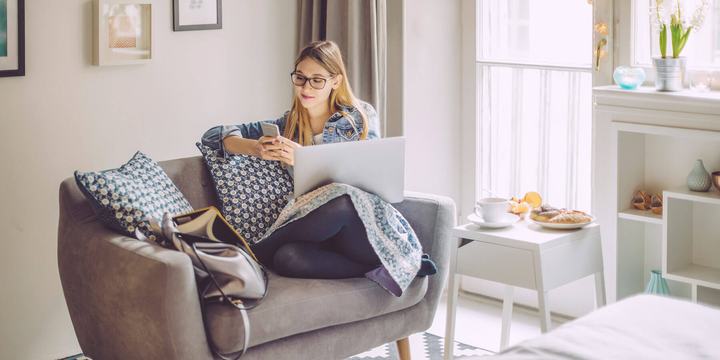 woman-using-technology-in-living-room.jpg