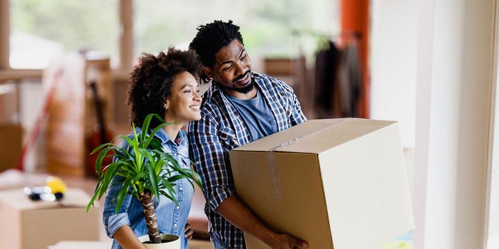 young-couple-holding-moving-boxes (1).jpg